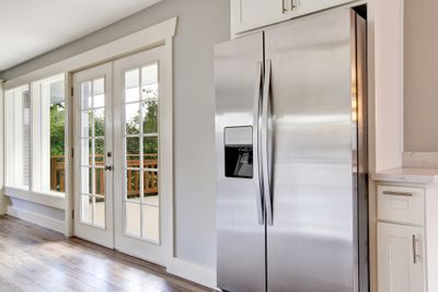 A side by side refrigerator in a kitchen
