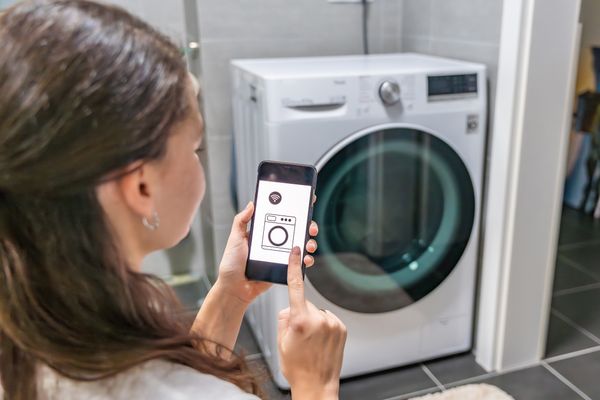 A woman using a smart feature from a smart device 