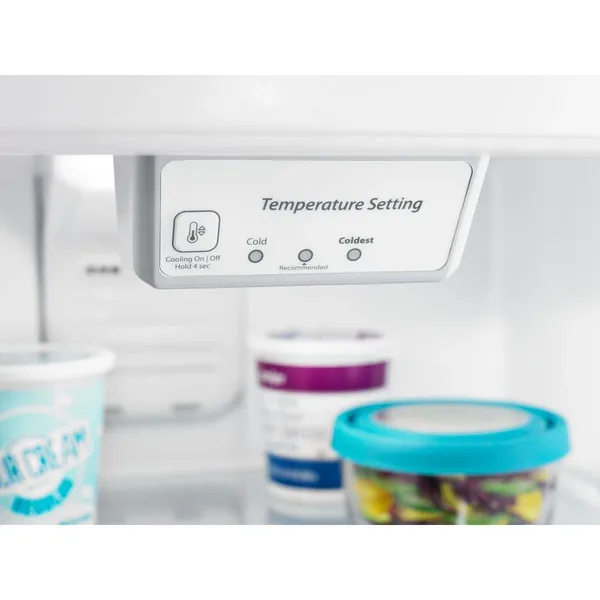 A close-up of the Amana ART318FFDS refrigerator interior