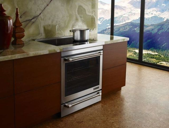 Front view of a JennAir induction range with a pot of water cooking on it