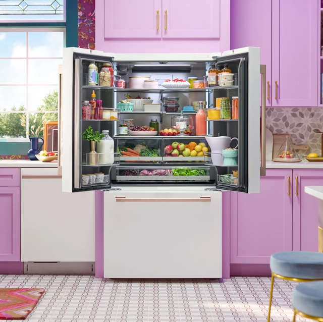 Front view of an opened LG studio white french door refrigerator