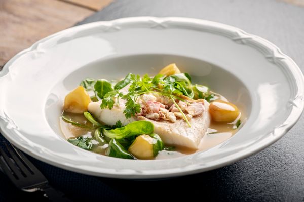 A close-up of a Beurre blanc fish platter