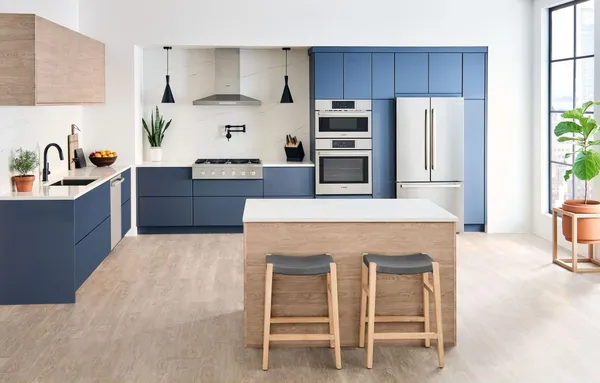 A blue kitchen featuring the Bosch 800 Series HBL8753UC oven 