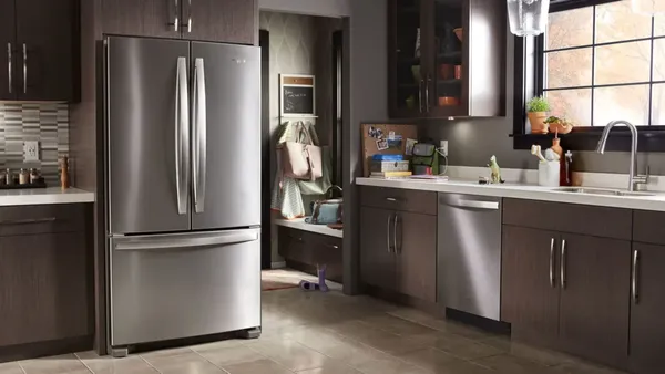 built in stainless steel french door refrigerator in a modern kitchen