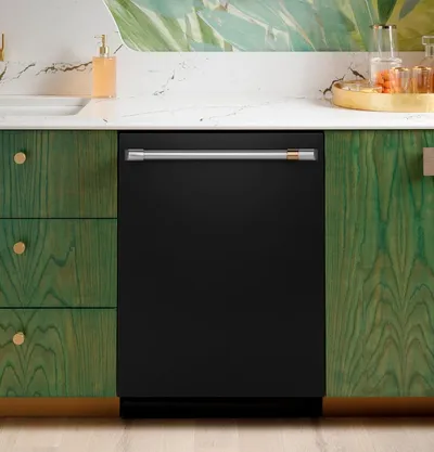 Credit: Cafe The Cafe CDT858P3VD1 dishwasher installed within green cabinets