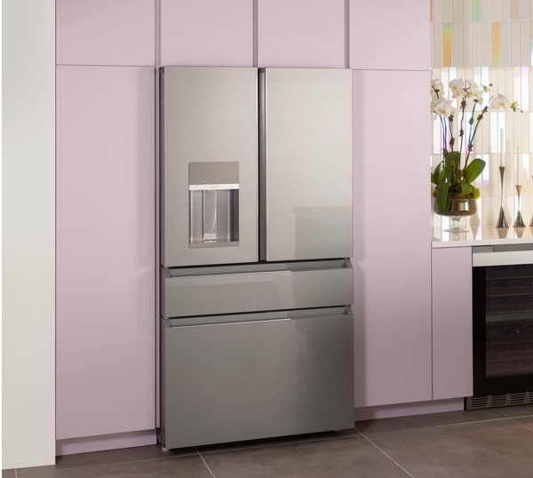 The Cafe CXE22DM5PS5 in a kitchen with lilac cabinets 
