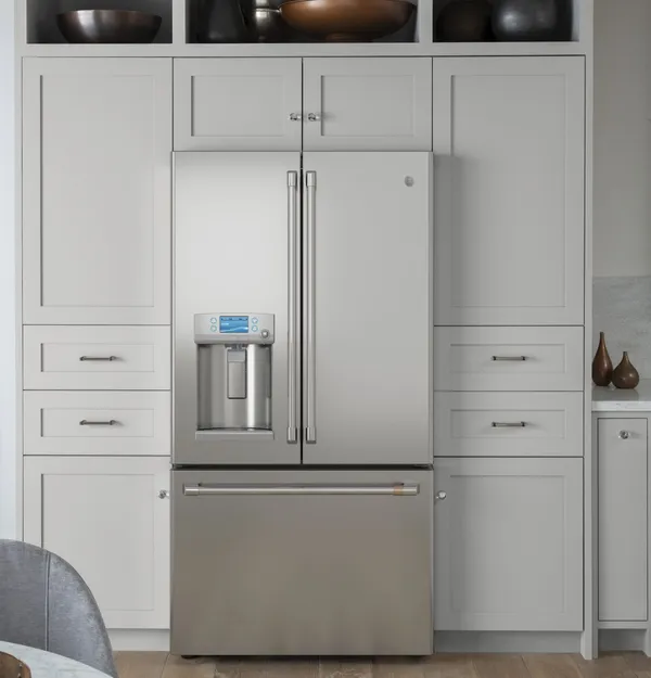 The Cafe CYE22TP2MS1 refrigerator in a kitchen 
