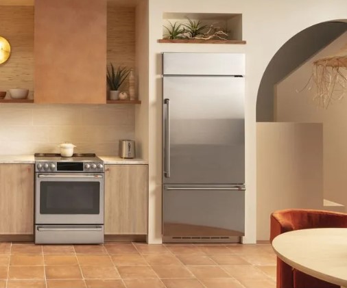 A modern brown kitchen with a Cafe range and built in Cafe refrigerator.