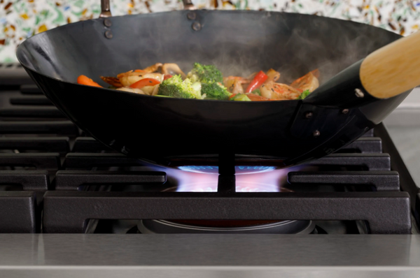 Credit: Cafe A wok cooking over the Cafe Inspiral Burner