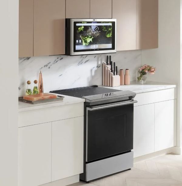 A Cafe 30" Platinum Glass range with a matching over-the-range microwave