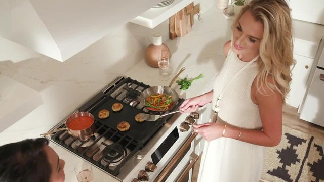 aerial view of a woman cooking on a gas stove