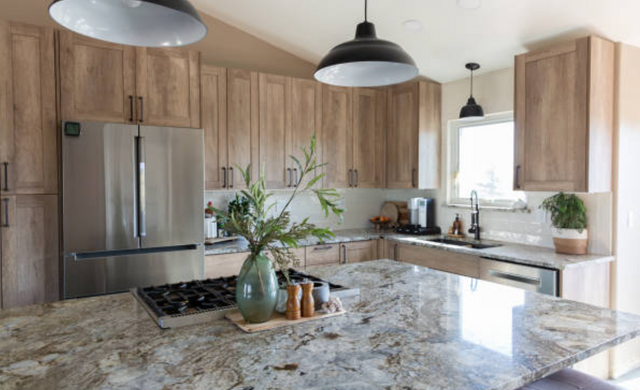 front view of a modern kitchen island with a range built into it