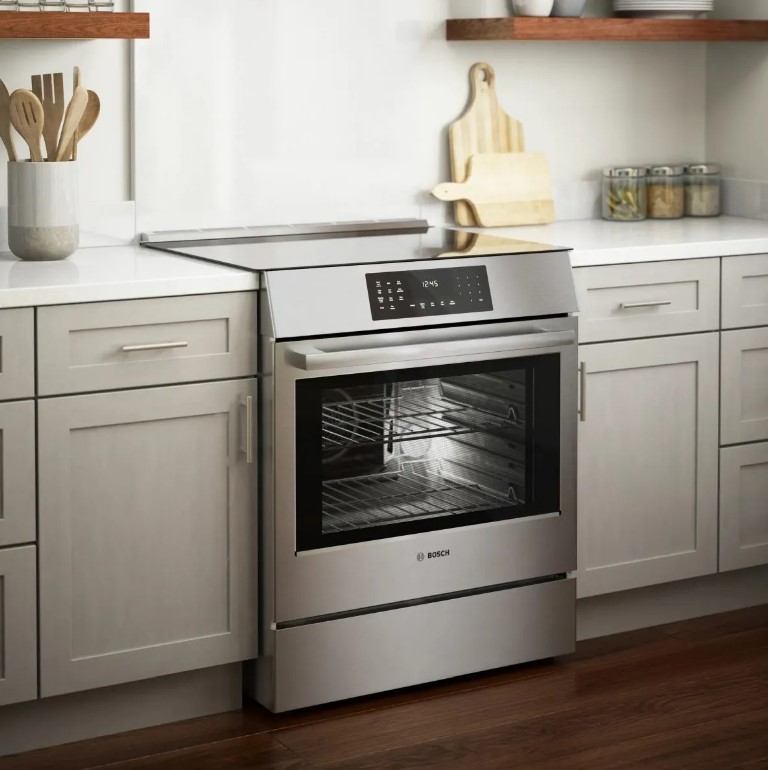 Bosch slide in induction range installed in a modern kitchen