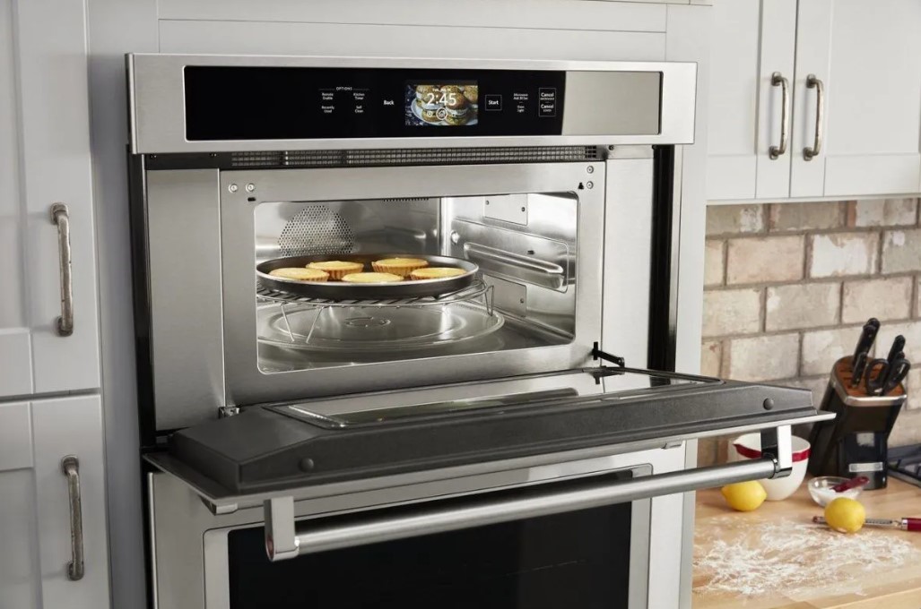 KitchenAid microwave with a digital display and open door