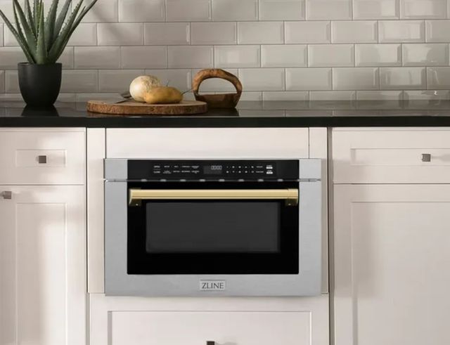 front view of a zline microwave drawer built into white cabinetry