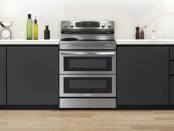 Kitchen featuring a Samsung gray double oven electric range