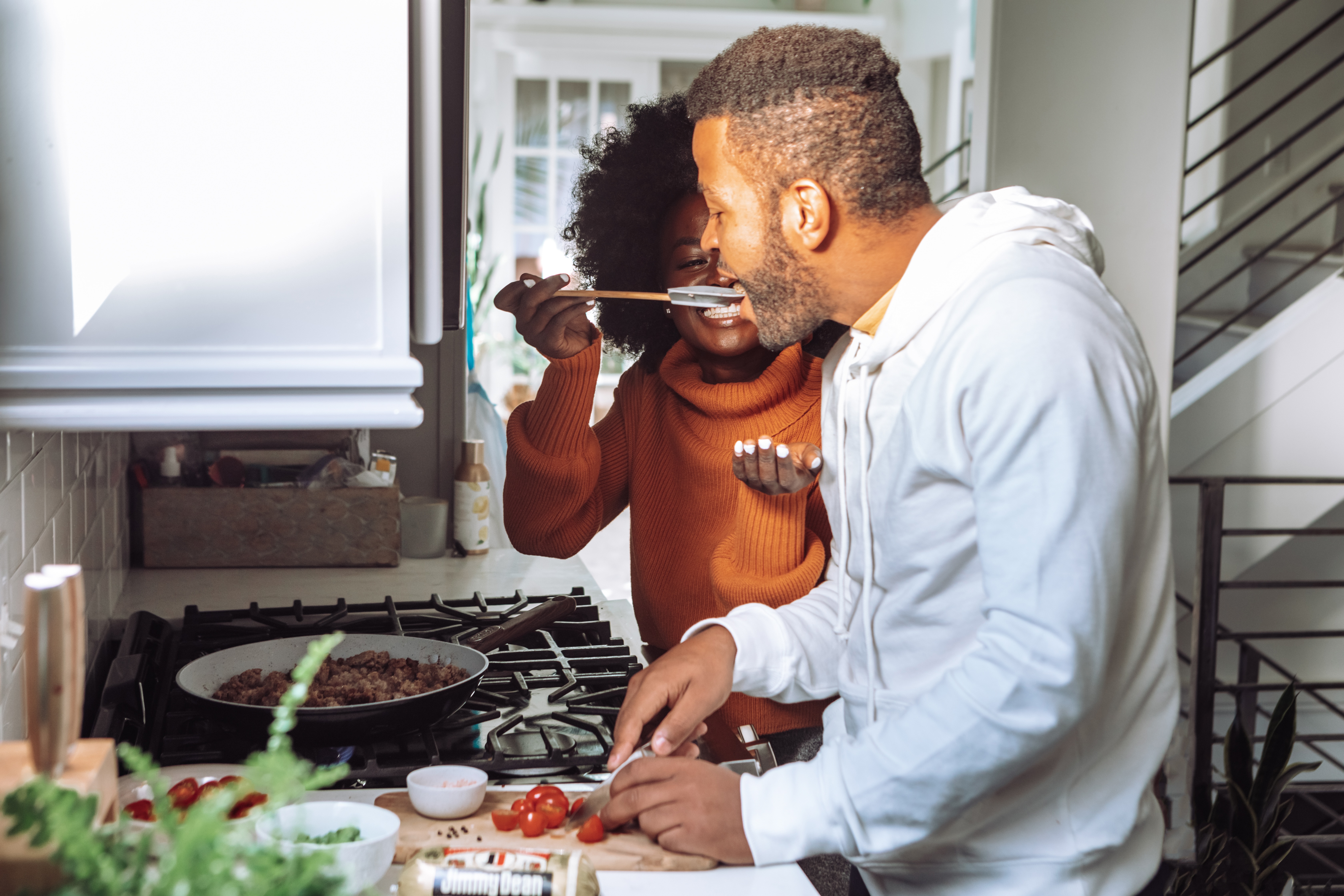 Couple Cooking and Trying Food