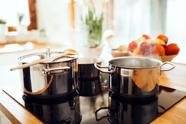 A cooktop full of cookware 
