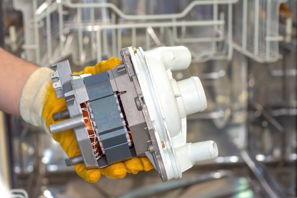 A close-up of a dishwasher motor 