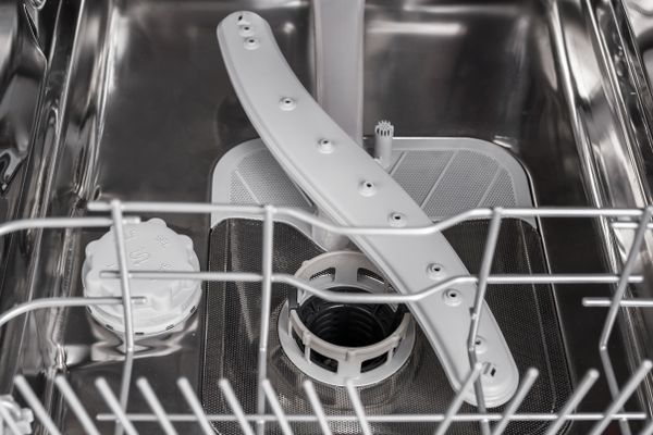 A close-up of the inside of a dishwasher 