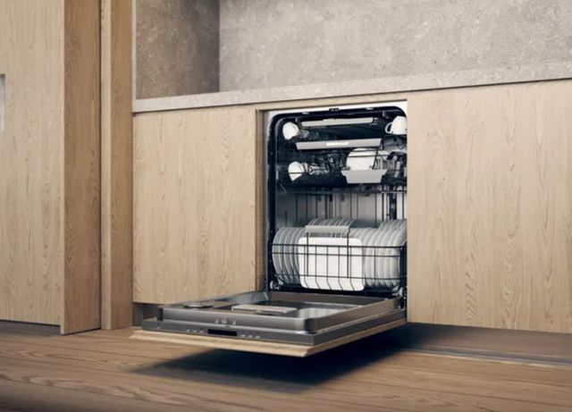 asko 40 series dishwasher opened in light wood cabinetry