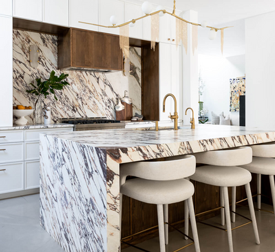 A beautiful white marble contemporary luxury kitchen designed by Nikki Chu.