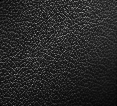 A close-up of the texture of a Carbon Cuts Leather Panel." title="A close-up of the texture of a Carbon Cuts Leather Panel