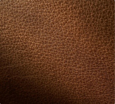 A close-up of the texture of a Cognac Cuts Leather Panel." title="A close-up of the texture of a Cognac Cuts Leather Panel