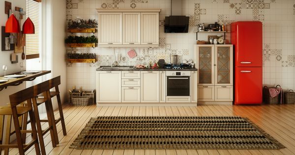 A boho kitchen with a red refrigerator 