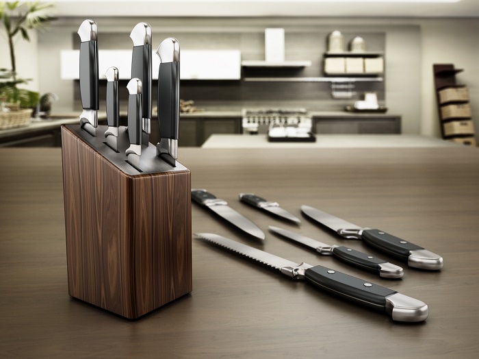 New knife set displayed in kitchen.