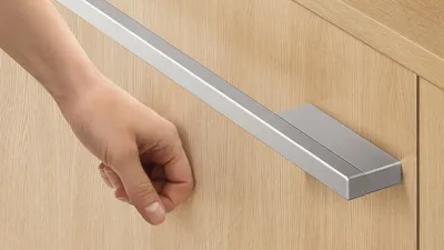 A person knocking on a Fisher & Paykel drawer dishwasher 