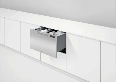 An open Fisher & Paykel Series 5 DD24SAX9 N dishwasher drawer in a kitchen