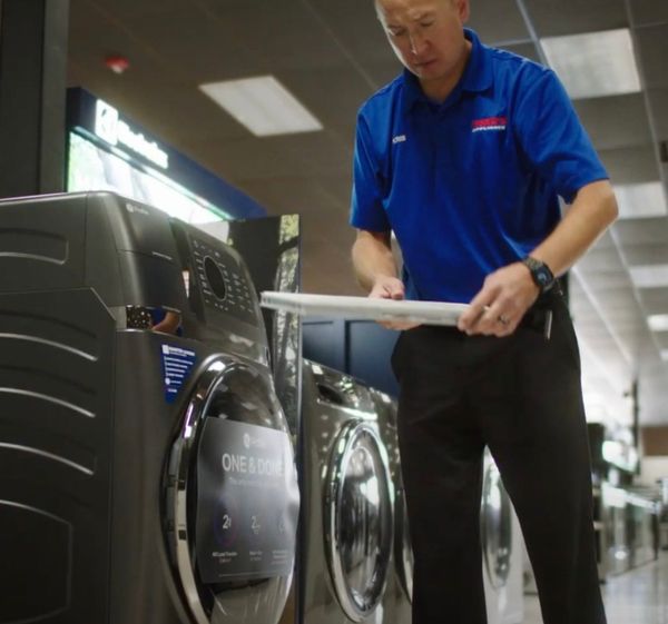 A Fred’s Appliance employee in the laundry section 