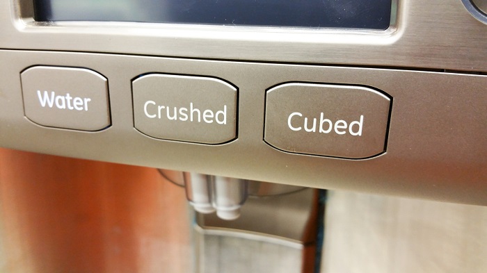 Water & ice buttons on a refrigerator.