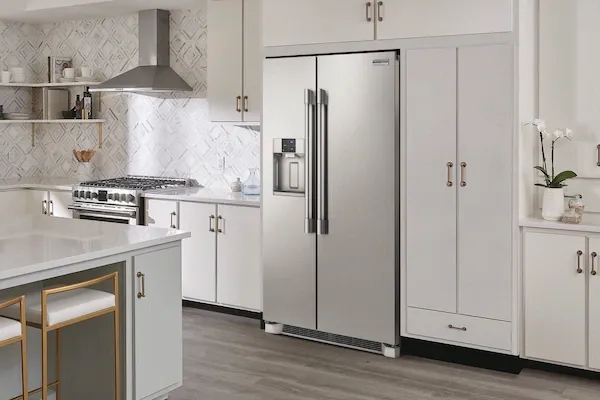 A kitchen featuring the Frigidaire Professional PRSC2222AF side by side refrigerator
