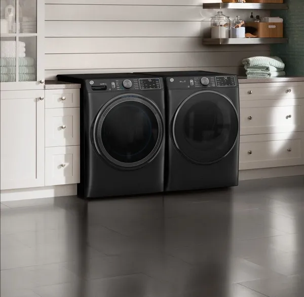 The GE GFW655SPVDS GFD65ESPVDS laundry pair in a laundry room