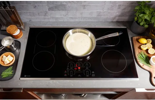 A sauce simmering on the GE Profile PHP9036STSS 36” cooktop