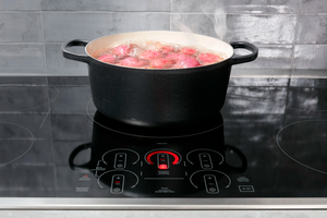 A pot of potatoes boiling on the GE Profile PHP9036STSS cooktop