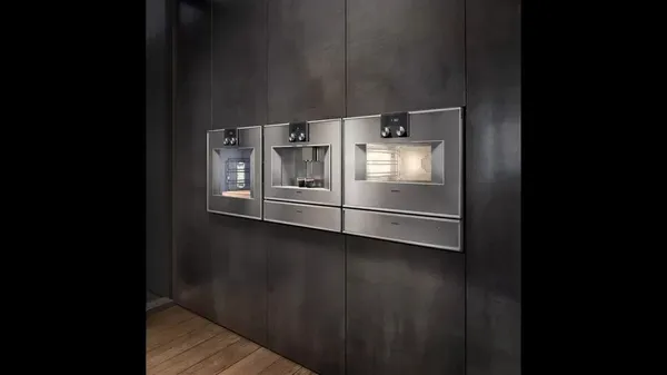 The Gaggenau 400 Series CM470712 coffee maker featured on an appliance wall 