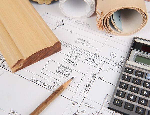 Overhead view of kitchen blueprints with builder tools 