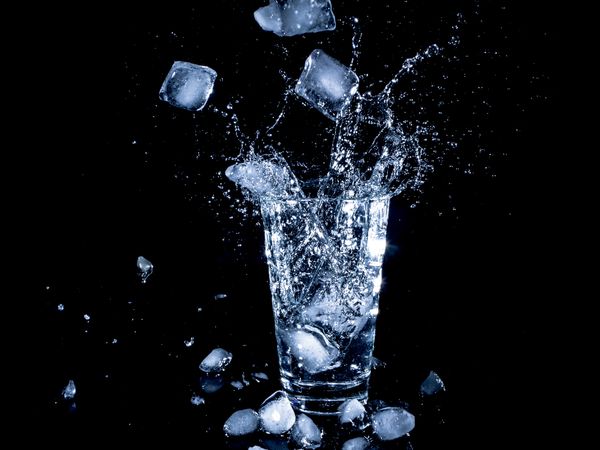 Ice Cubes Dropping in Clear Water