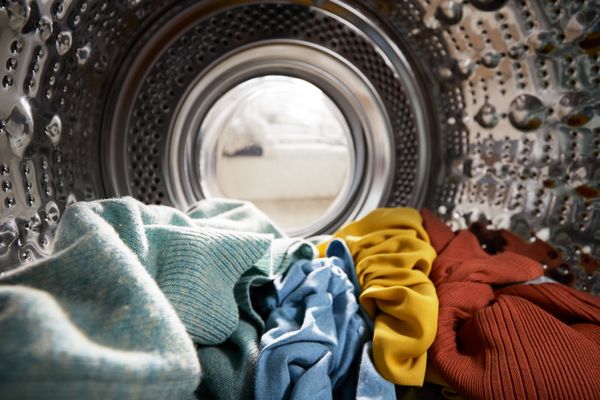Clothes shown from inside of a front load washer 