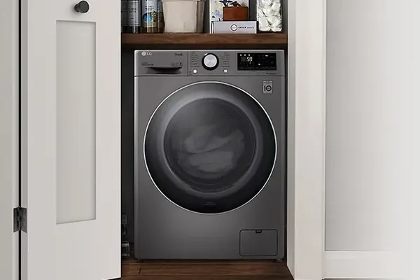 The LG WM3555HVA washer dryer combo in a closet 