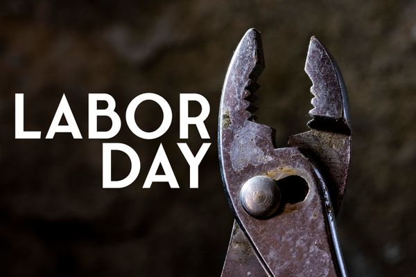 A close-up of Lineman’s pliers next to white Labor Day text 