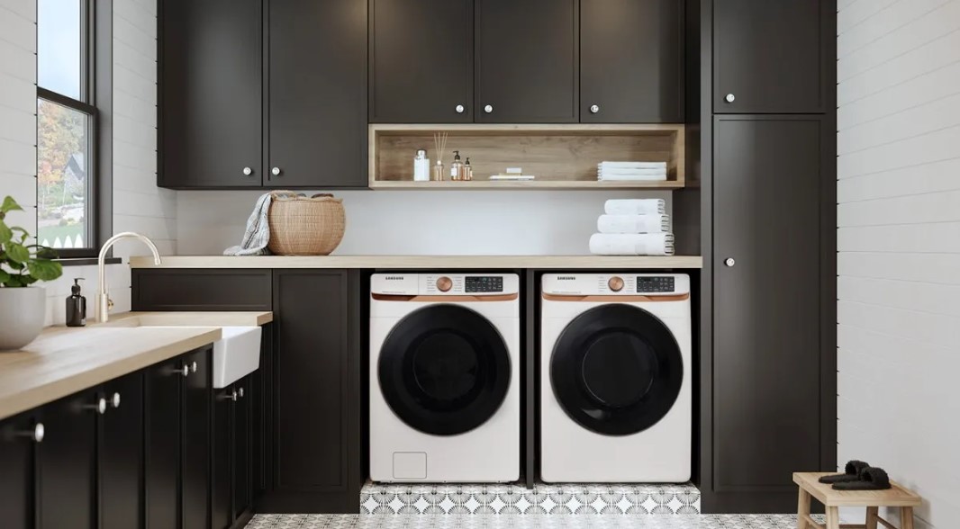 Ivory Samsung front load washer and dryer in a modern laundry room