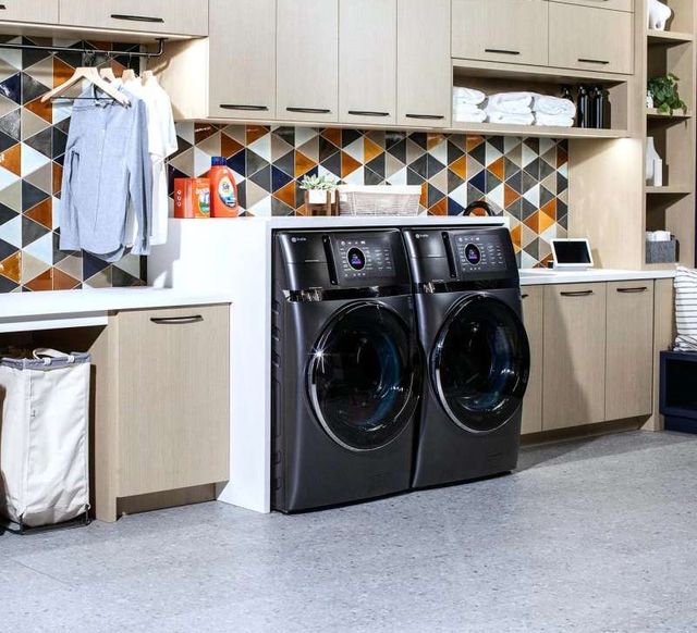 front view of two GE Profile washer dryer combos in a modern laundry room