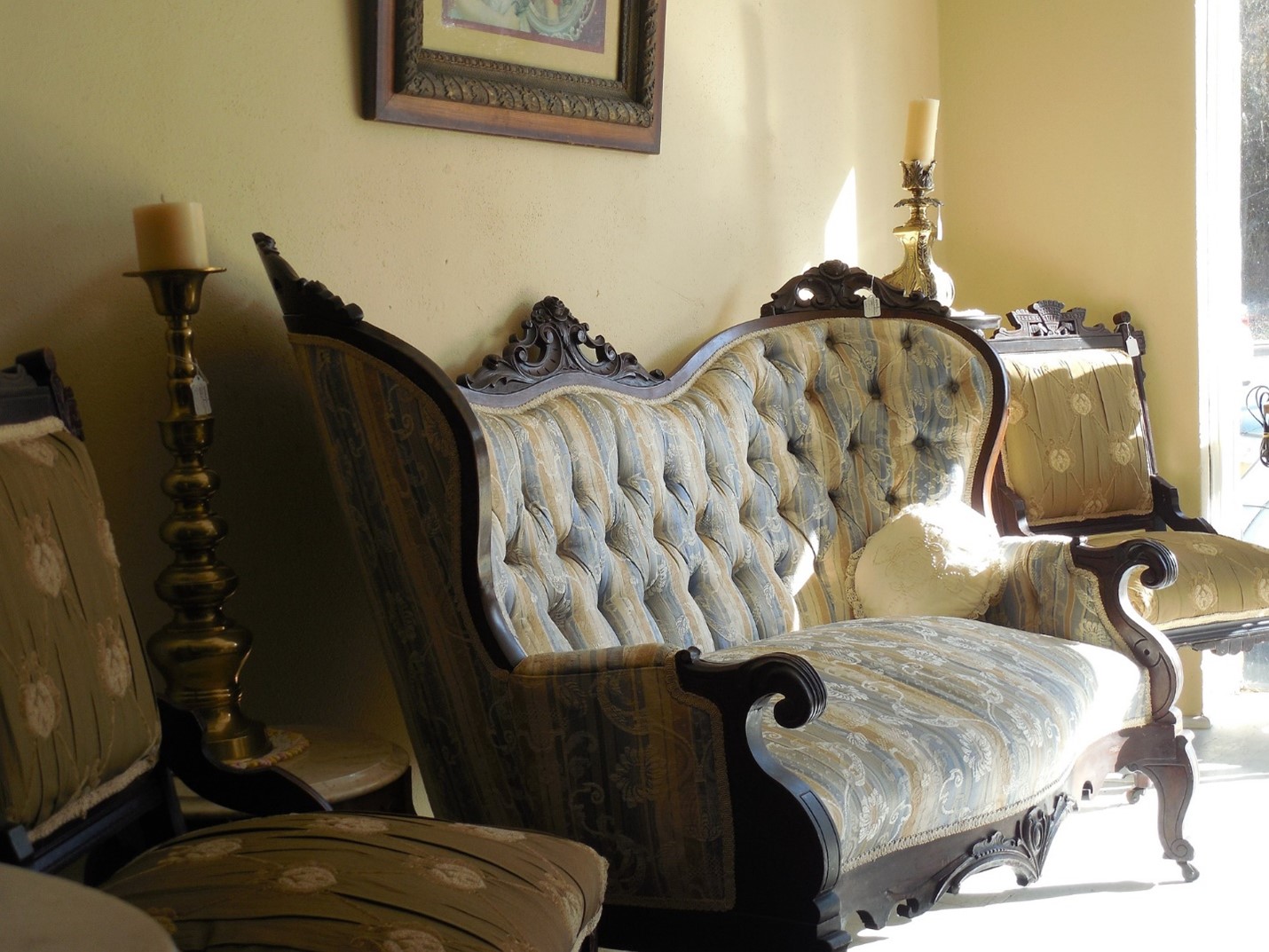 traditional curved upholstered wooden-leg loveseat
