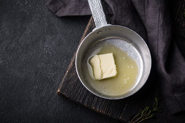 Overhead view of butter melting in a pot