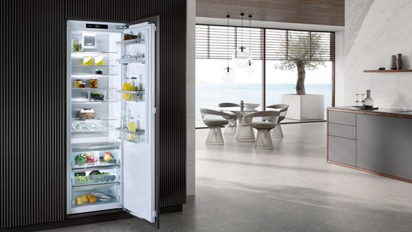 A kitchen featuring a Miele integrated refrigerator