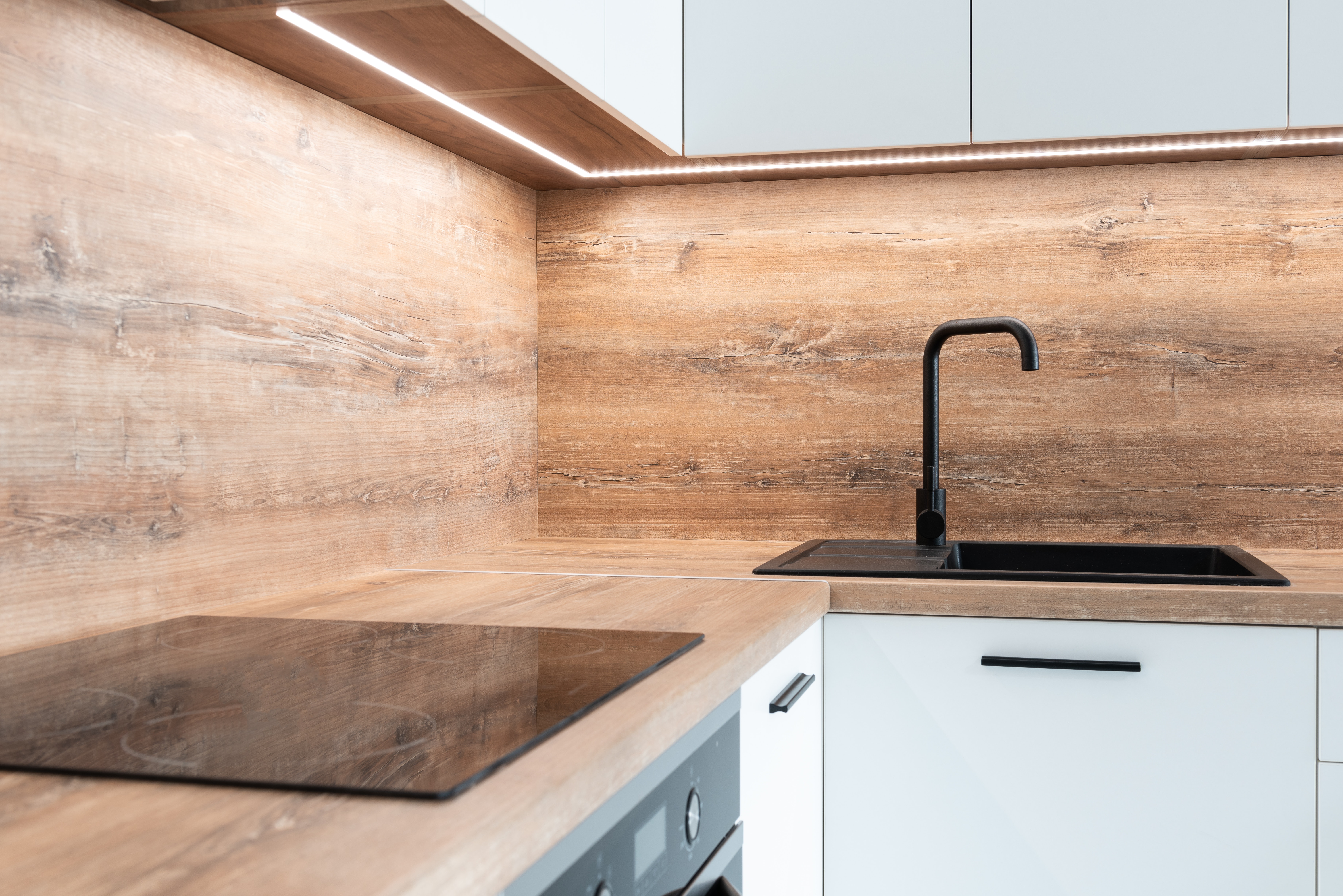 A modern kitchen with wooden cubpoards